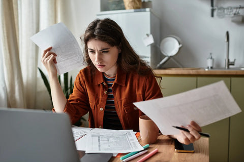 Frustrated and stressed woman at desk
